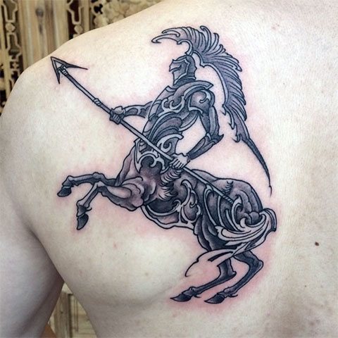 Tattoo Sagittarius on the shoulder blade