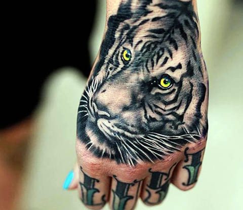 Tattoo of a tiger on the wrist