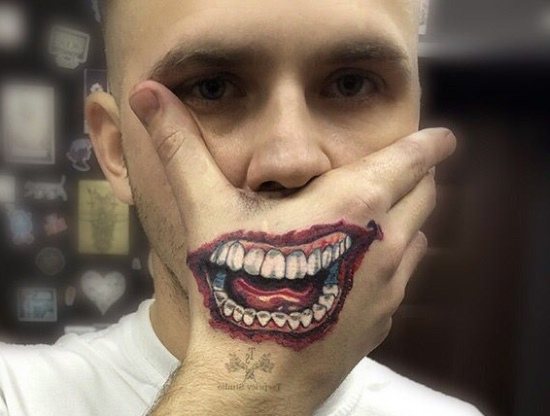 Tattoo Joker's Smile on his arm. Sketches, photo
