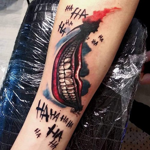 Tattoo Joker Smile on his arm. Sketches, photo