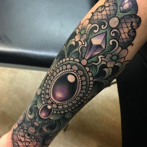 Tattoo in the Baroque style. Sketches on the arm, wrist, leg, back, waist. Photo