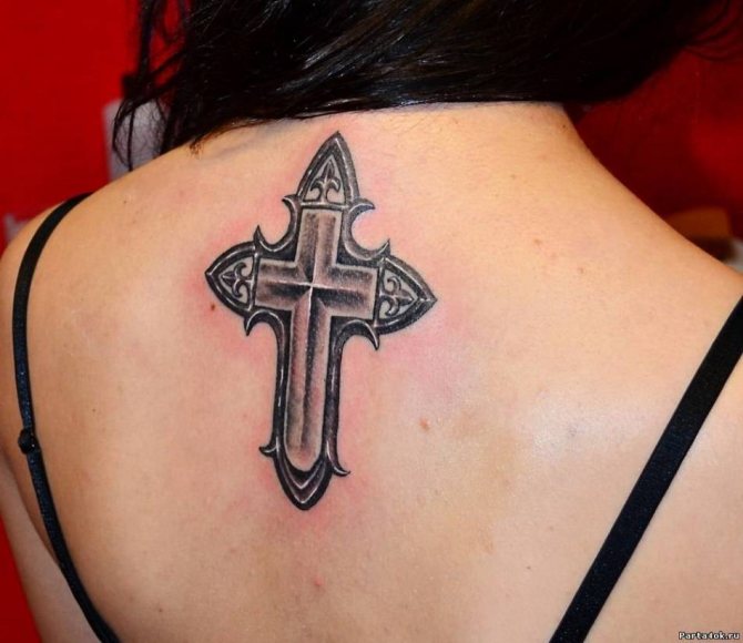 Tattoo in the form of a cross from the evil eye