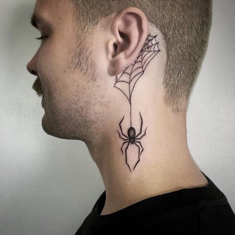 Tattoo in the form of a spider, hanging down from a spider's web - is also an interesting solution