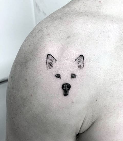Dog tattoo on shoulder