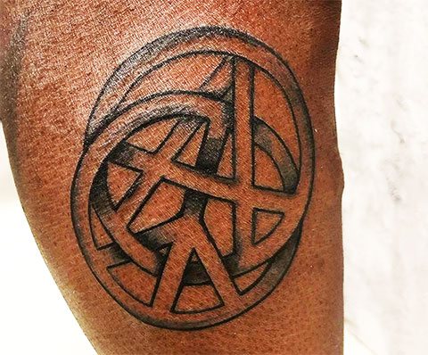 Tattoo in the form of a sign of anarchy