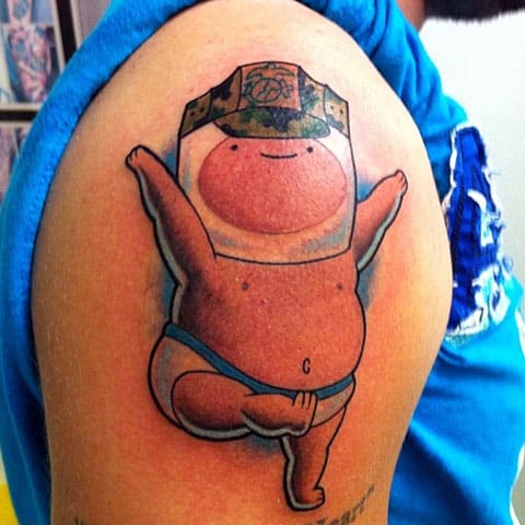Adventure Time tattoo on his shoulder