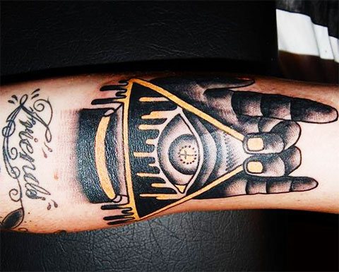 Tattoo of the all-seeing eye in a triangle - photo