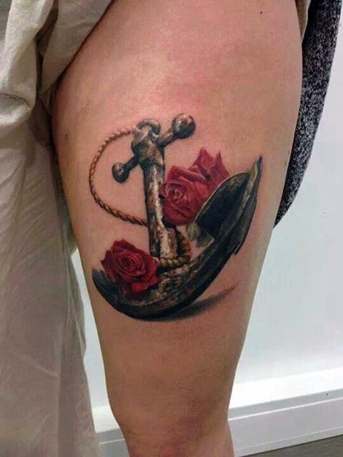 Tattoo Anchor with a Flower on Her Thigh