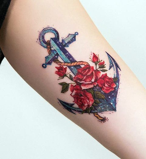 Tattoo anchor with roses on girl's wrist