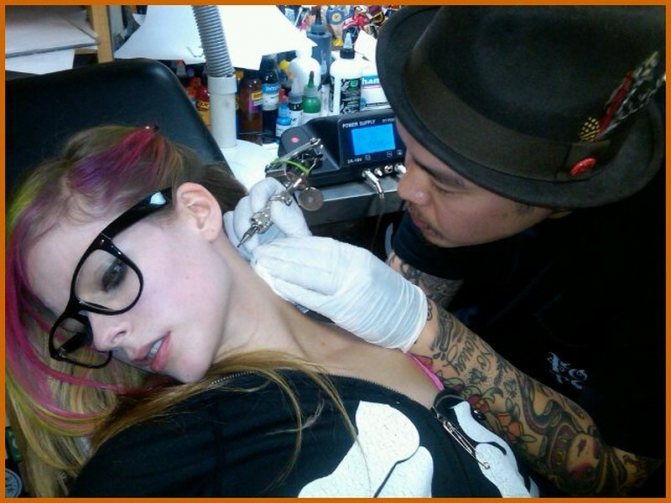 Tattoo behind girls ear