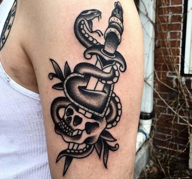 snake tattoo with a dagger on his shoulder