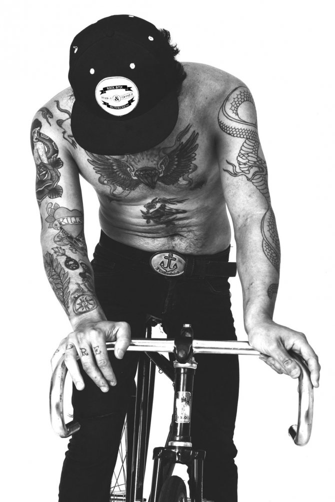 Tattooed man on a bicycle