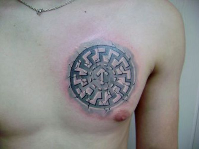 Black sun tattoo on male chest