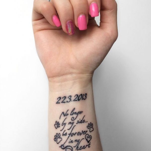 Date tattoo and inscription on the wrist