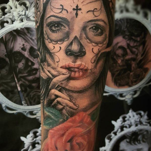 Mexican style girl tattoo on hand