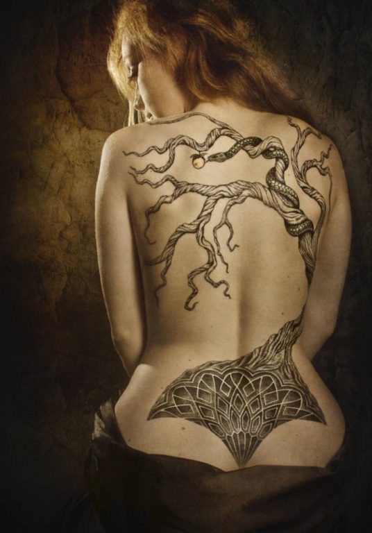 Tattoo of an ancient tree on his back