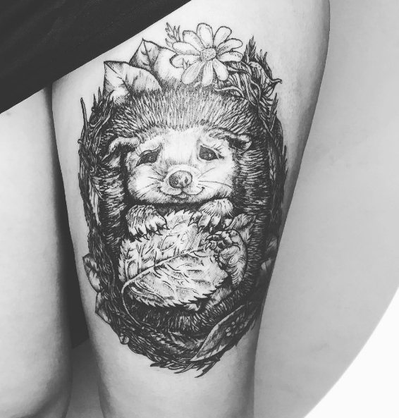Tattoo of a hedgehog on a girl's leg
