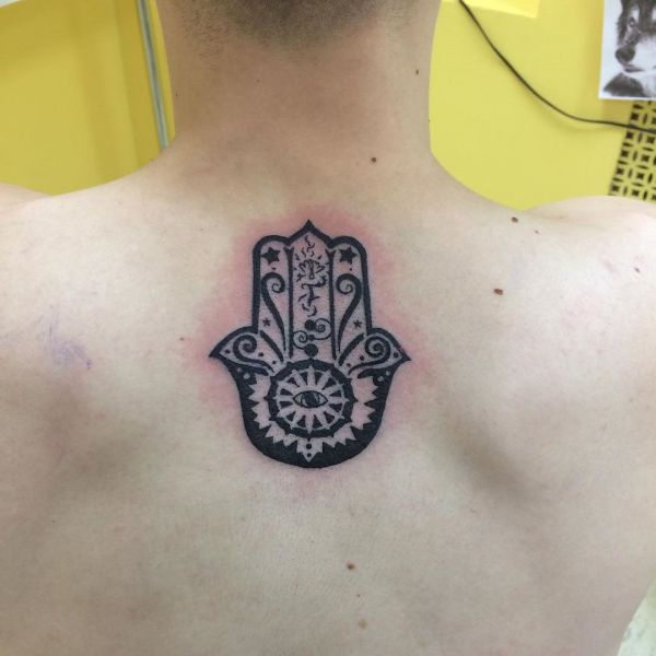 Tattoo of a sheepskin on a girl's back