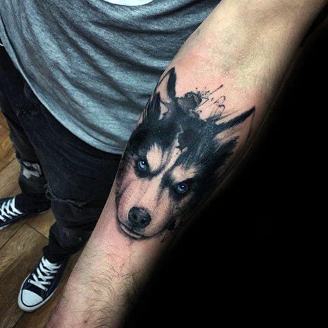Husky tattoo on his arm