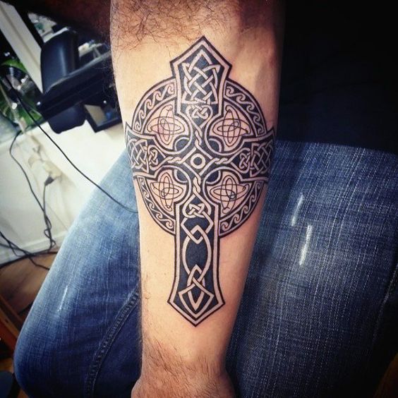 Irish cross tattoo on hand