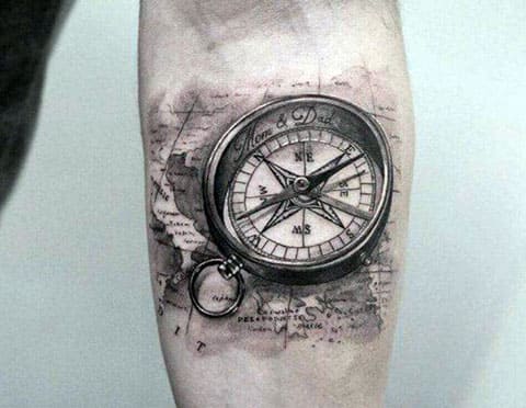 Compass tattoo on a man's arm