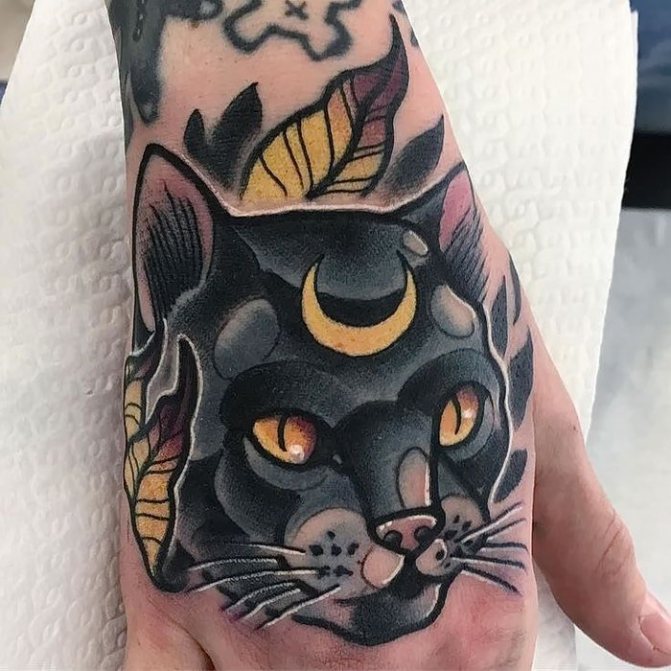 Black cat tattoo on the wrist