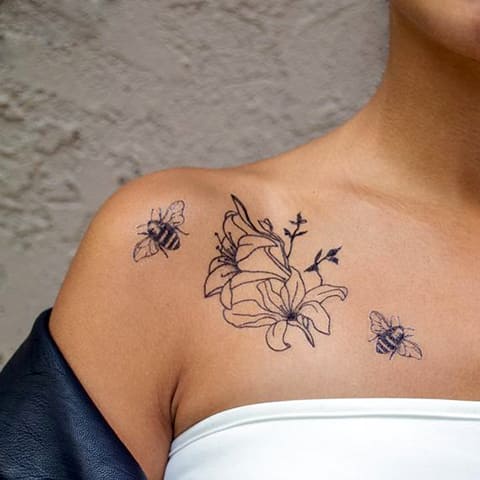 Lily tattoo on collarbone