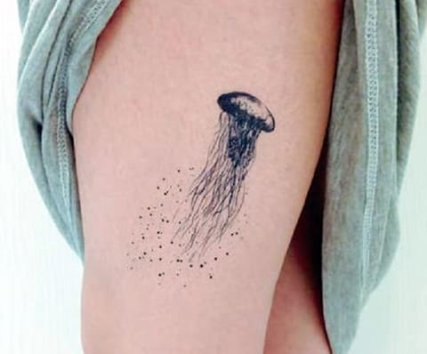Jellyfish tattoo on girl's leg