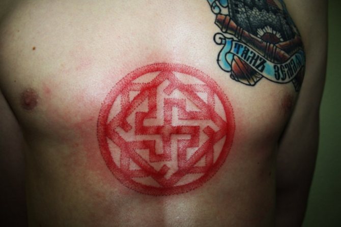 Men's tattoo of a Valkyrie amulet