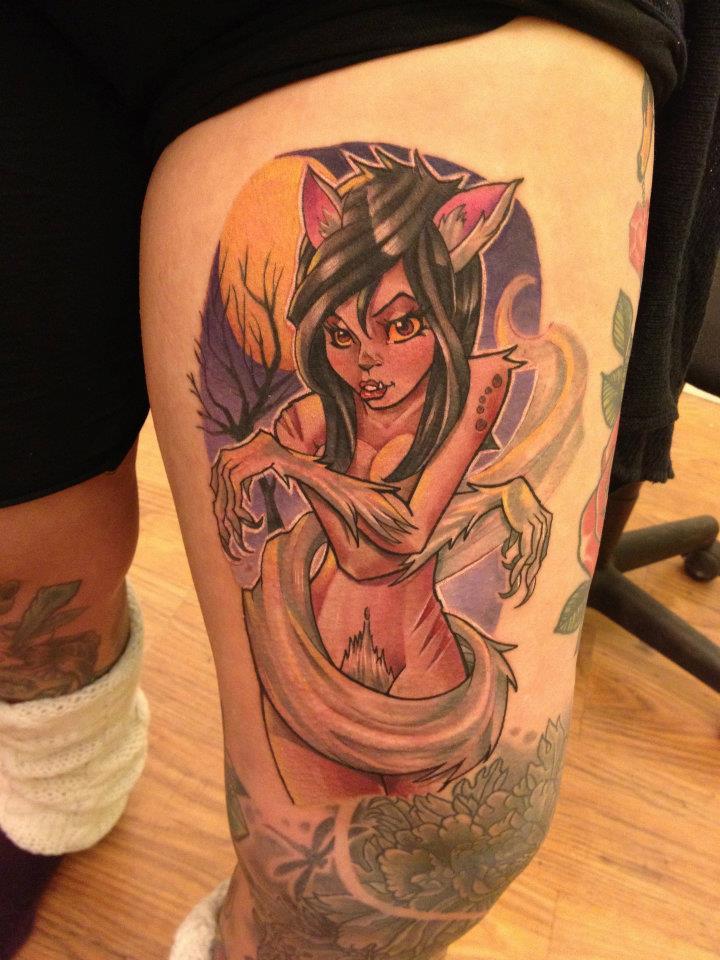Tattoo of a werewolf girl on his thigh