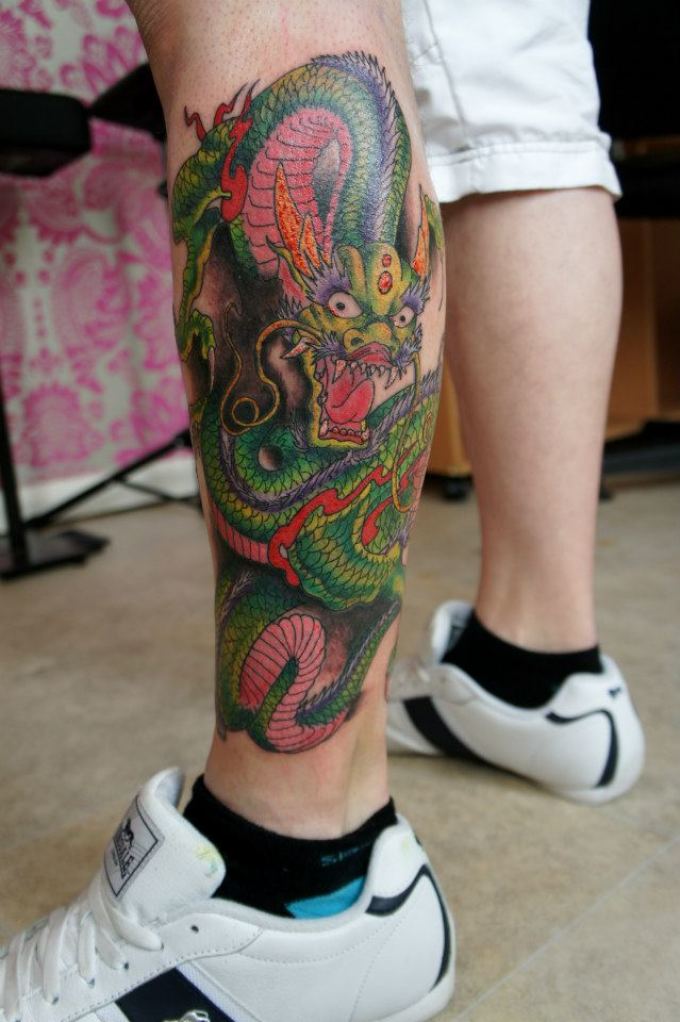 Dragon shin tattoo