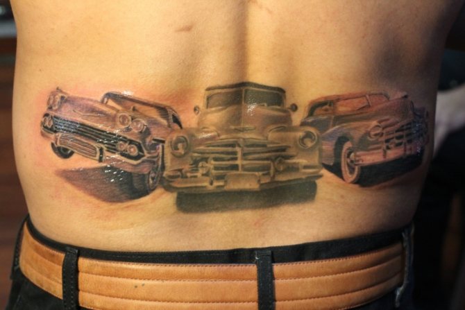 Tattoo on men's lower back in the form of cars