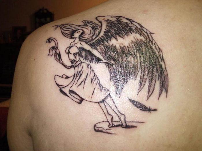 Angel keeper tattoo on his shoulder