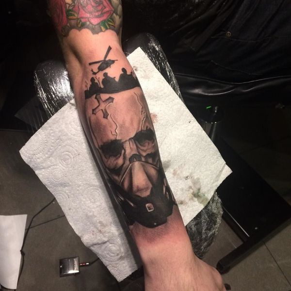 Tattoo on forearm - tattoo of evil