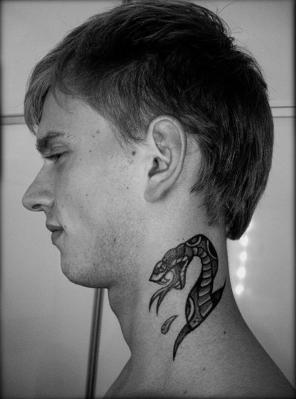 Tattoo as a snake on a man's neck