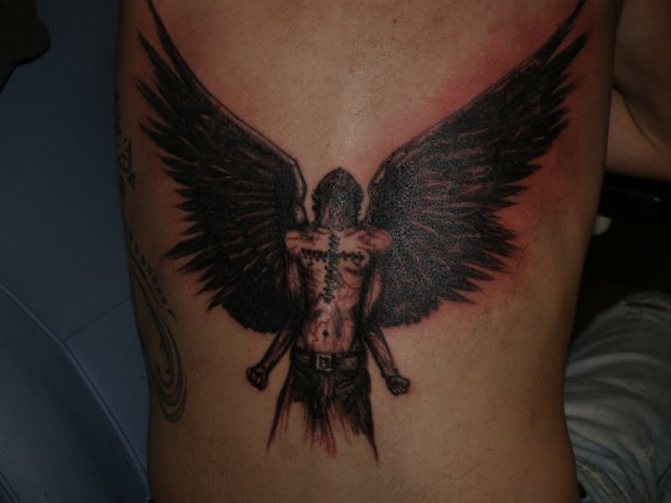 Fallen angel tattoo on the back of a man