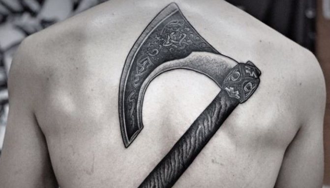 Tattoo on his back Axe of Perun