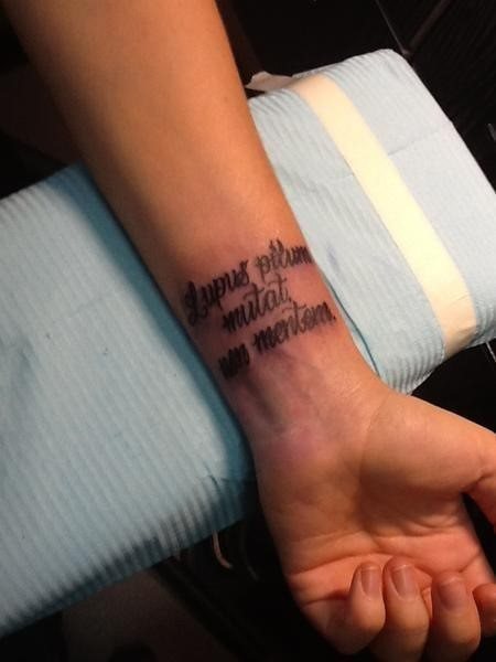 Tattoo of the inscription on the wrist by Maxim