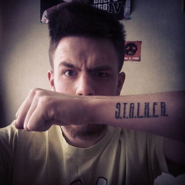 Stalker tattoo on guy's arm