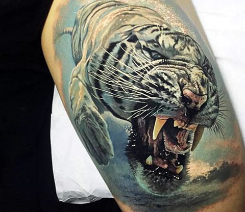Tattoo of a tiger grinning - photo