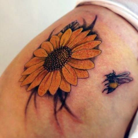 Tattoo of a bee and flower