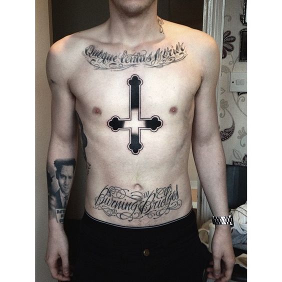 Inverted cross tattoo on chest