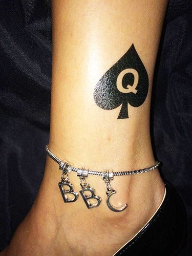 Tattoo of Spades. The meaning of the suit of spades in women, men