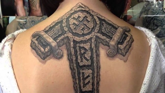 Tattoo realism runes on his back