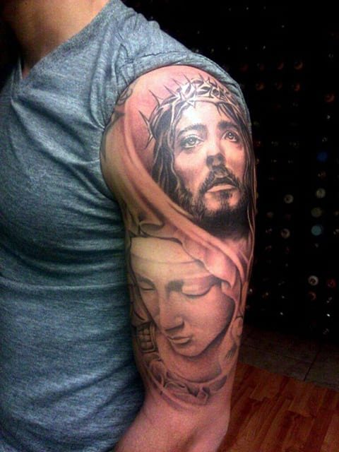 Tattoo of Jesus Christ on his arm