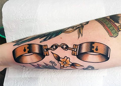 Tattoo with Shackles on your arm