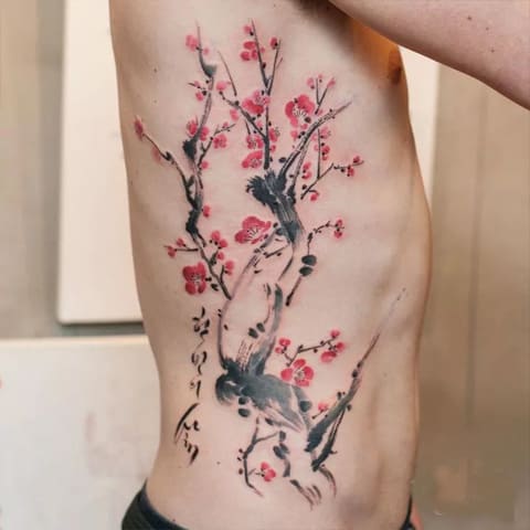 Tattoo with a sakura on a man - photo