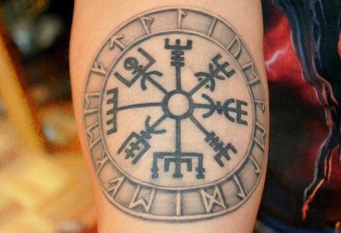 Tattoo with Scandinavian runic compass