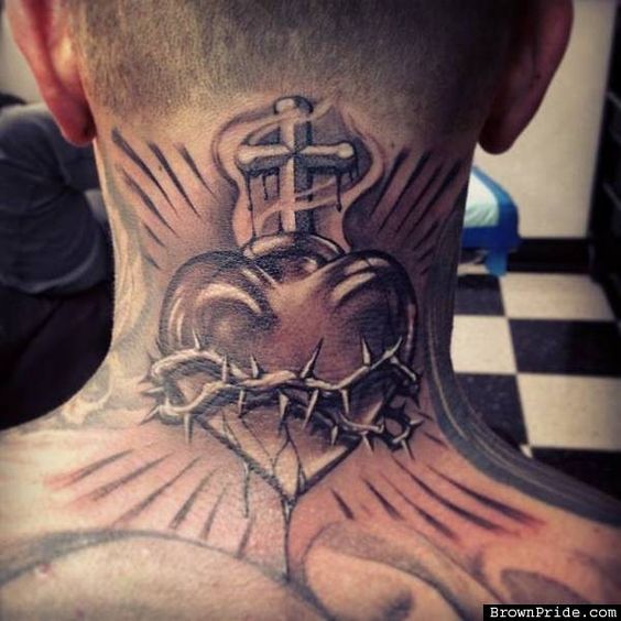 Heart and cross tattoo on neck