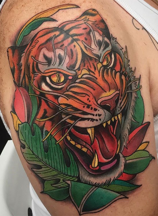 Tattoo of a tiger with a grin